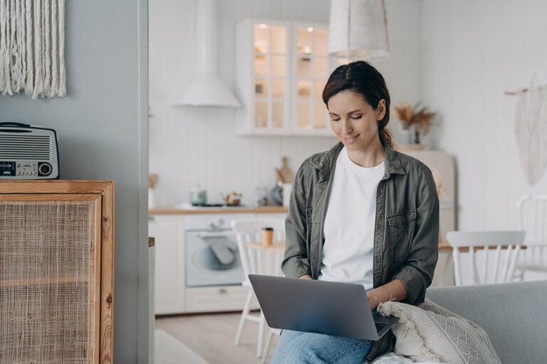 Woman at home using a laptop