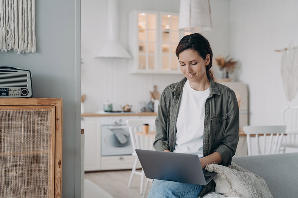 Woman at home using a laptop